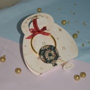 Γούρι Ρόδι κρεμαστό ξύλινο με σχεδιασμένα στεφανάκια και κρίκο