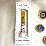 Λαμπάδα αρωματική λευκή με κορδόνια και ματόχαντρα